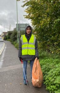 Standing still with a full bag of litter