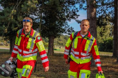 2 SARS first responders in full kit walking towards the camera